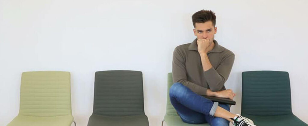 A man sitting in a chair.