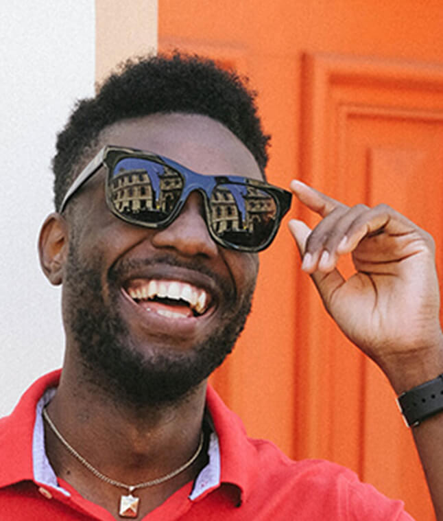 Man with sunglasses on smiling.